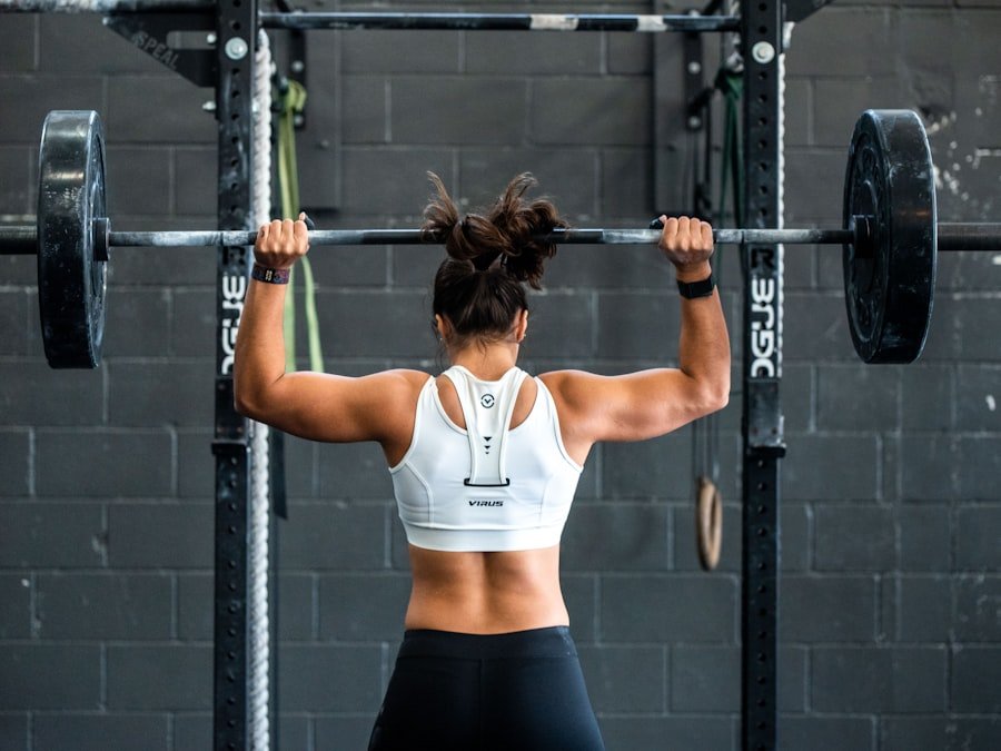 Athlete pressing a loaded barbell overhead